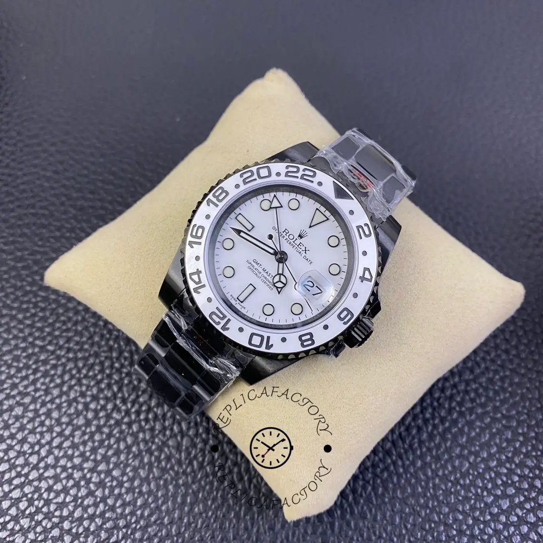 Rolex GMT-Master II 16710 top view on cushion, white dial and bezel, black coated bracelet.