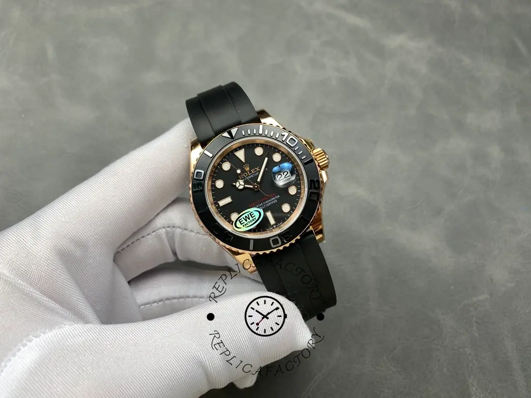 Rolex Yacht-Master 126655, black dial and bezel, Everose case, held in glove.