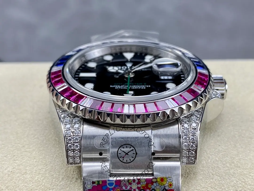 Rolex GMT-Master II 126710BLRO top view, black dial and gem bezel, on wrist rest.