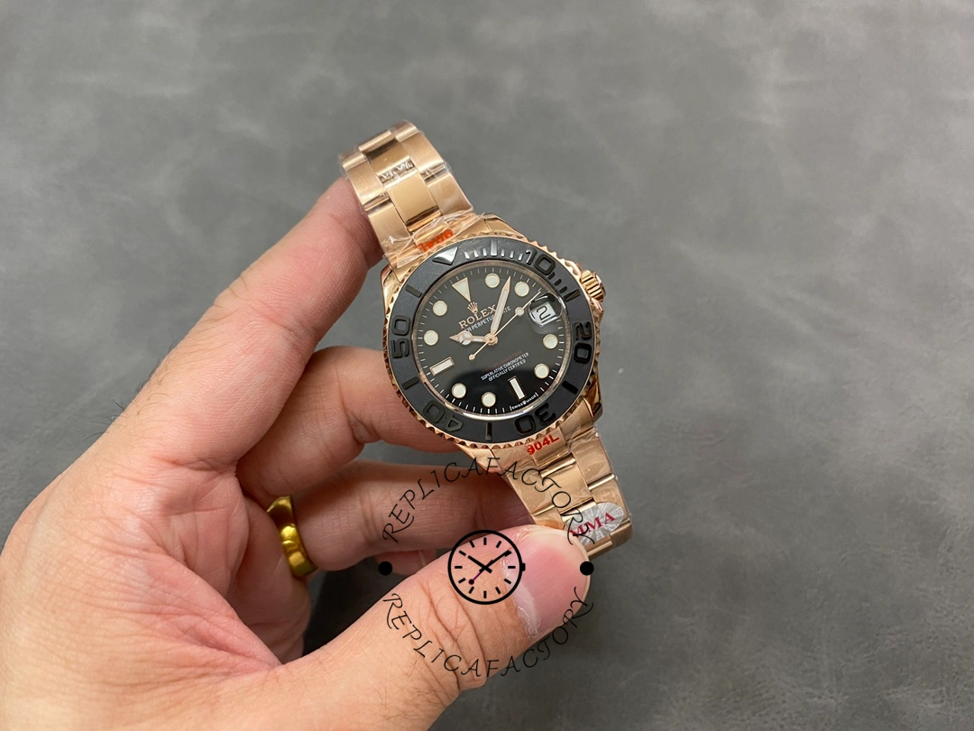 Full watch view of Rolex Yacht-Master m268655, black dial, held at distance.