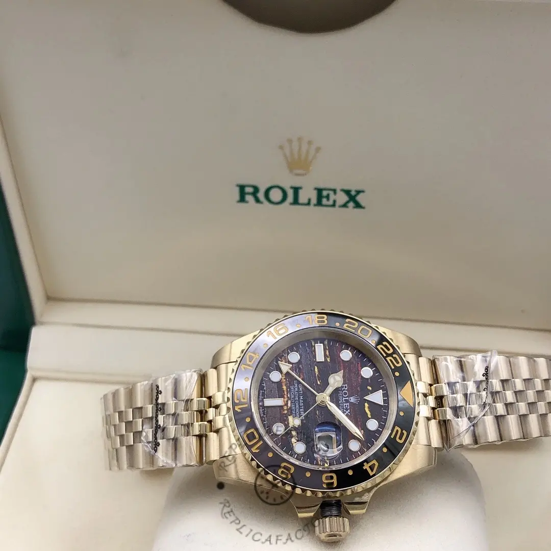Rolex GMT Master II m126718grnr 0002 on cushion, full watch view with Jubilee bracelet.