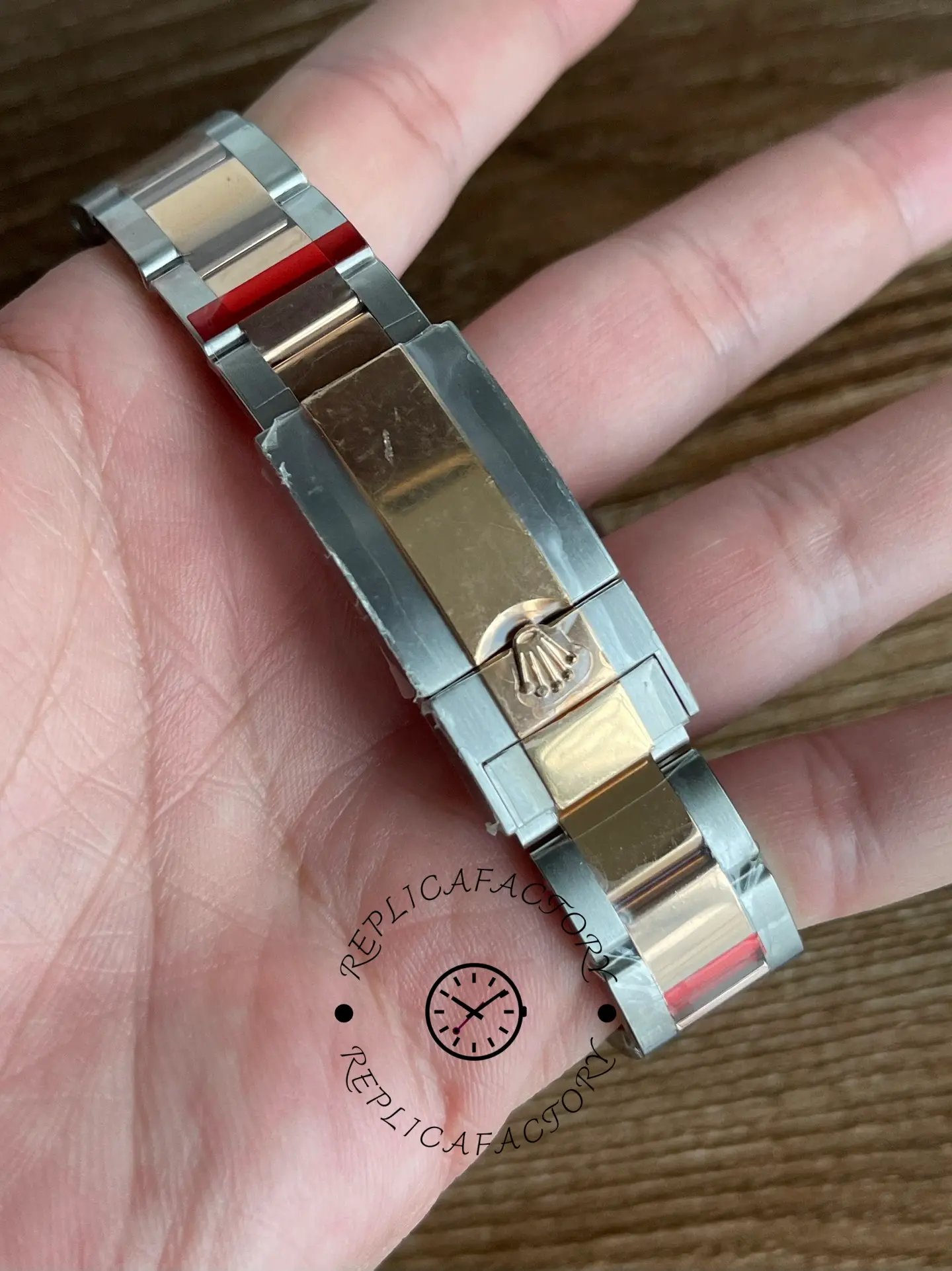 Rolex Yacht-Master 126621 clasp close-up in hand, Everose clasp and link finishing detail.