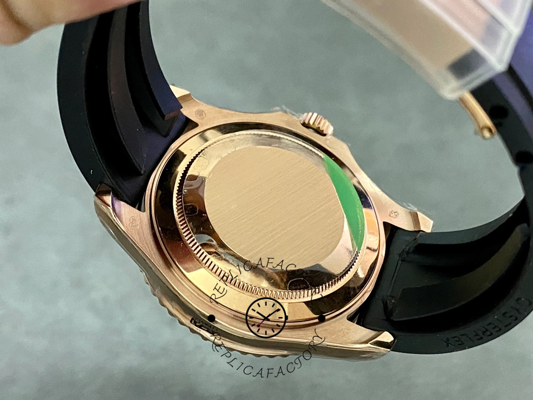 Rolex Yacht-Master 126655 case back view in hand, Everose back and strap, rear angle.