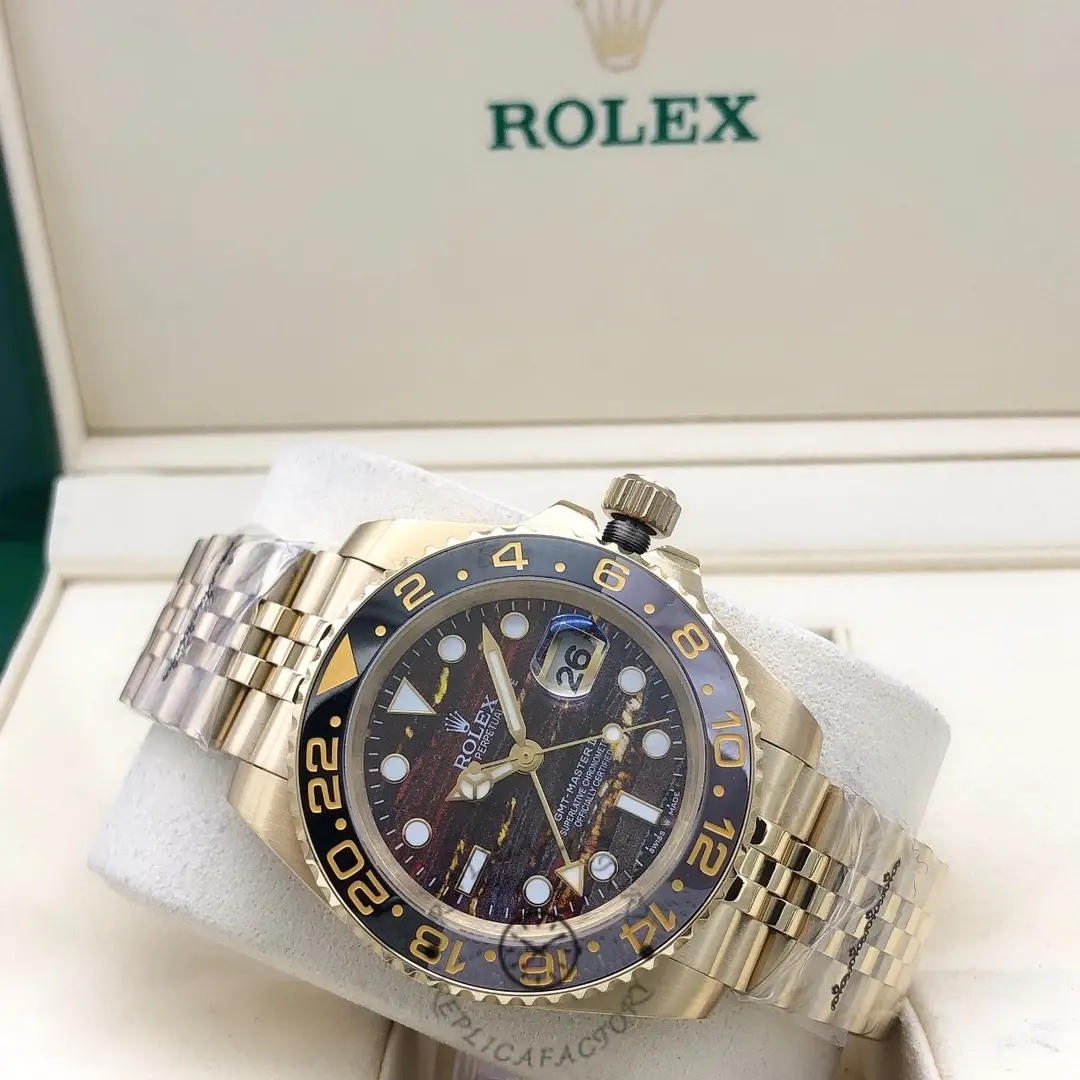 Angled view of the Rolex GMT Master II m126718grnr 0002 showing bezel and Jubilee bracelet.