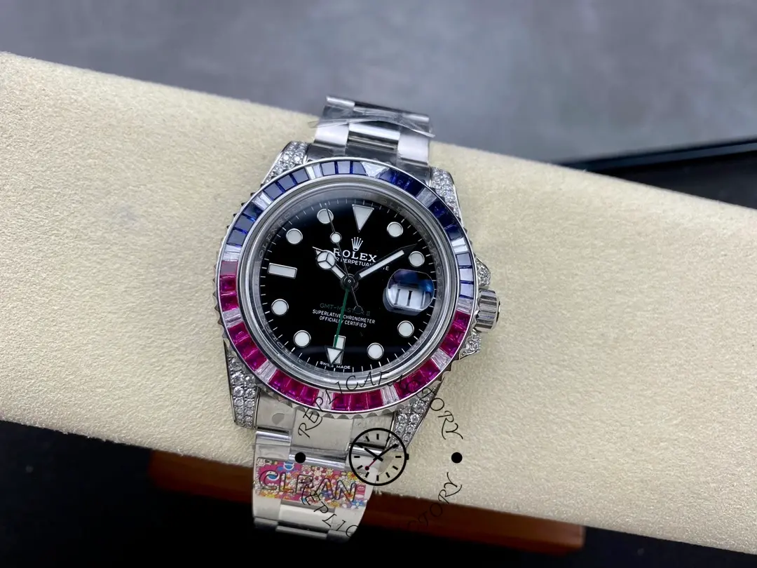 Rolex GMT-Master II 126710BLRO on wrist rest, diamond case and gem bezel, angled view.