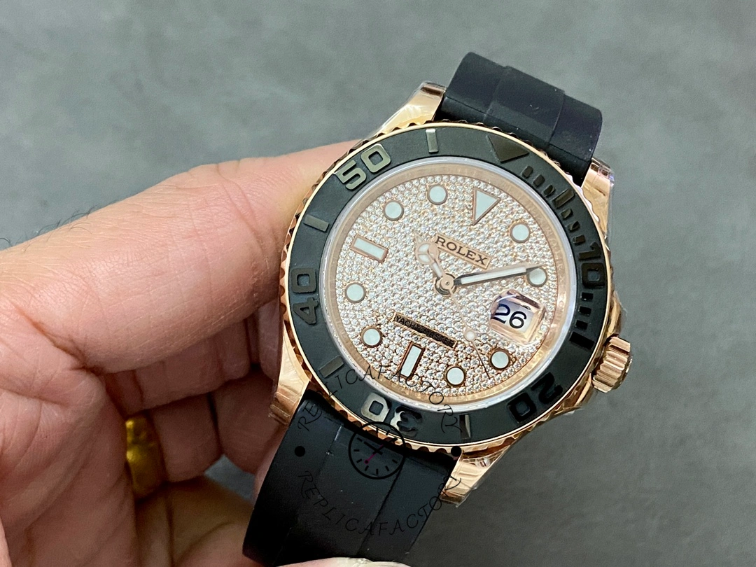 Rolex Yacht-Master 126655 held in hand, front angle showing pavé dial and bezel numerals.