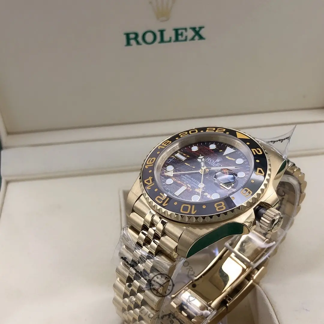 Side angle of the Rolex GMT Master II m126718grnr 0002 showing case profile and bracelet links.