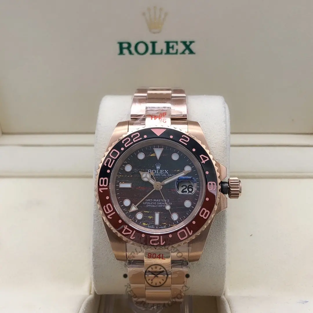 Rolex GMT-Master II M126715CHNR 0002 on display, black dial with Everose gold case and bracelet.