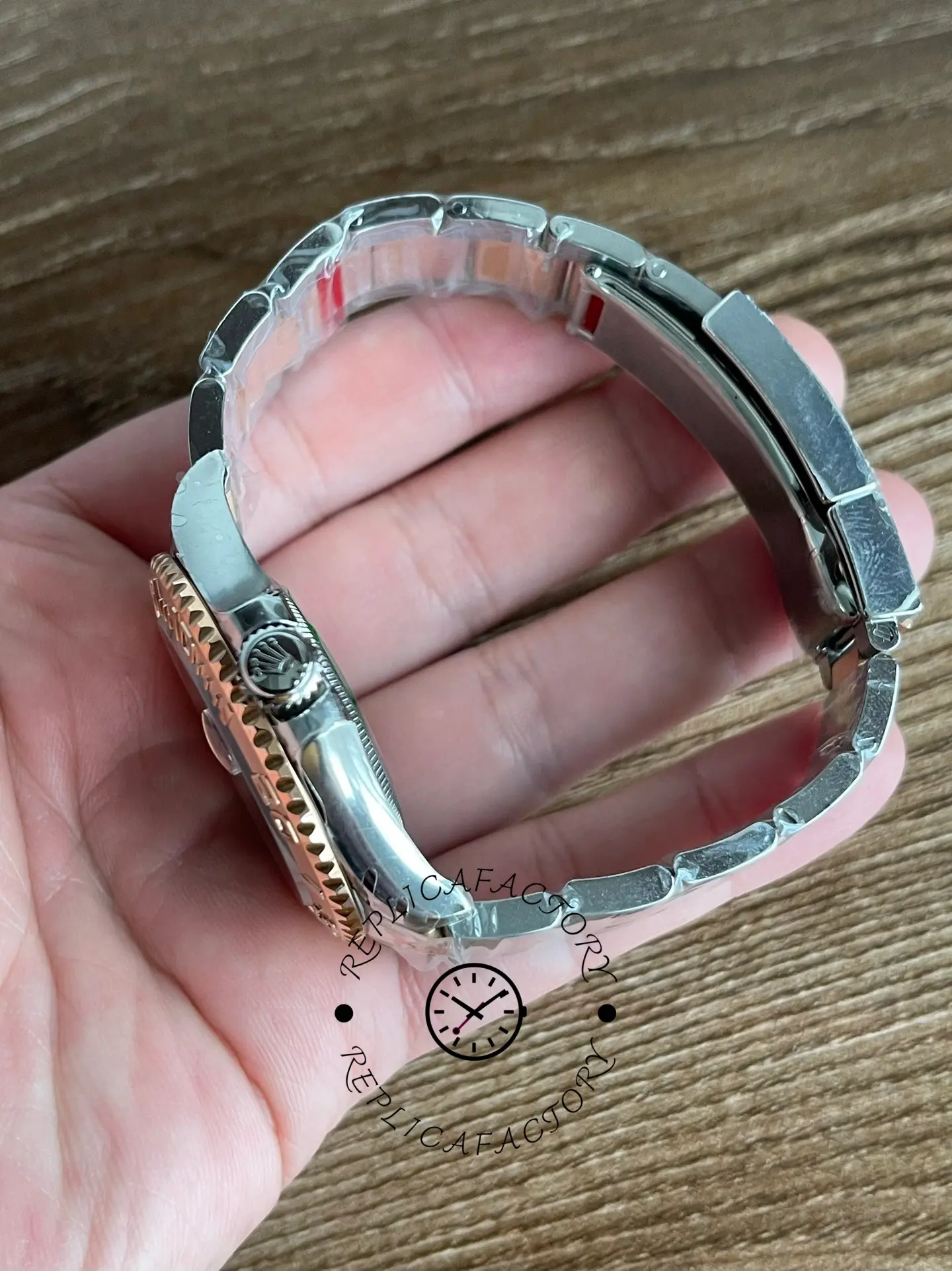 Rolex Yacht-Master 126621 bracelet loop view in hand, links and clasp area shown.