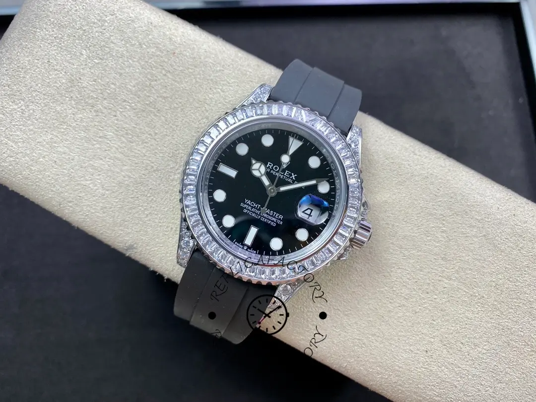 Full watch view of the Rolex Yacht-Master 226679TBR on pillow, black strap and case shown.