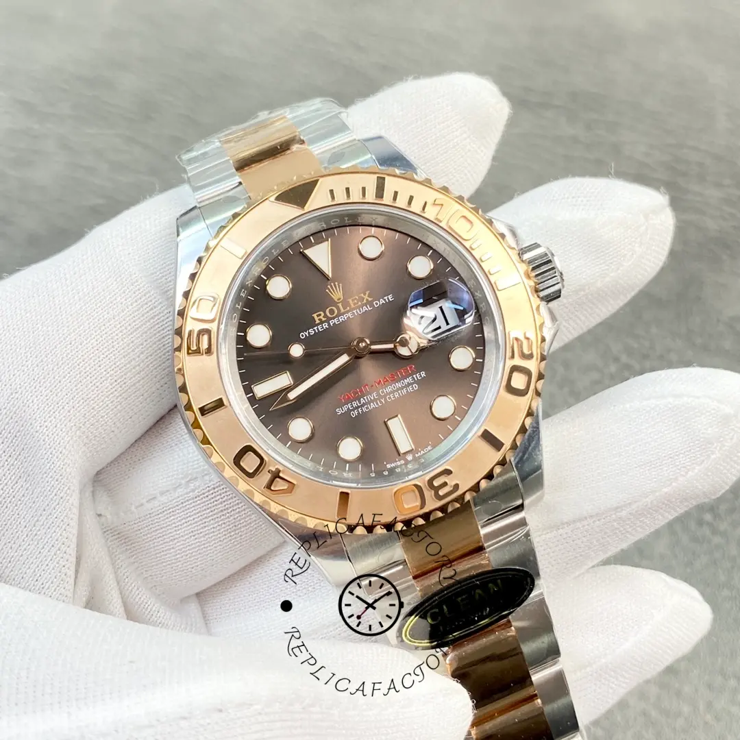 Gloved hand holding Rolex Yacht-Master 116621, angled view of bezel.