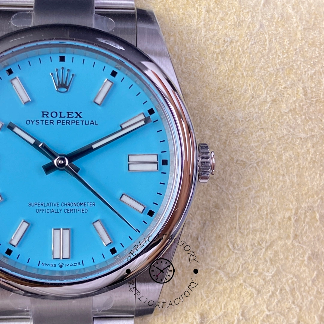 Rolex Oyster Perpetual 41 m124300 0006, macro view showing turquoise dial and applied Rolex crown.