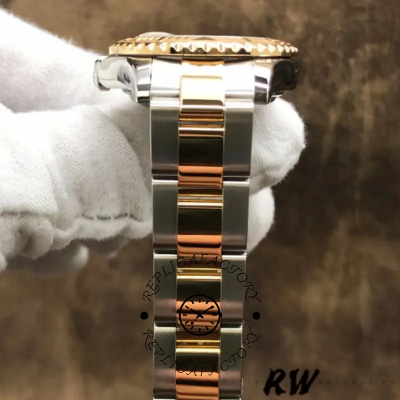 Rolex Yacht-Master 169623 bracelet side view, two-tone links and clasp area, in glove.