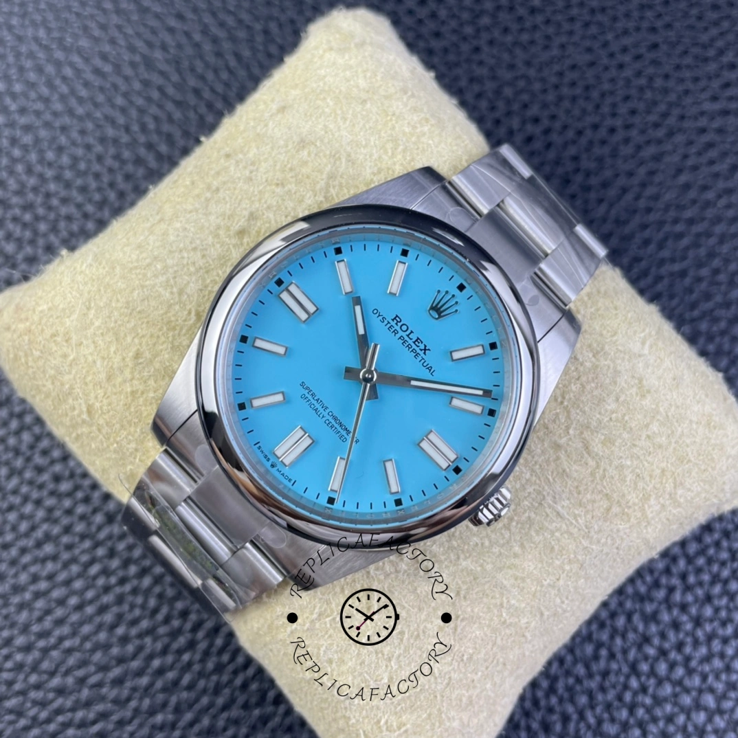 Rolex Oyster Perpetual 41 m124300 0006, close-up on pillow showing bezel and dial texture.