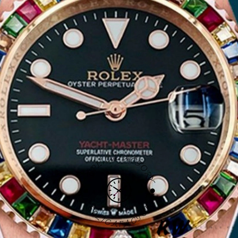 Dial close-up of the Rolex Yacht-Master 116695 showing black dial text and rainbow bezel stones.