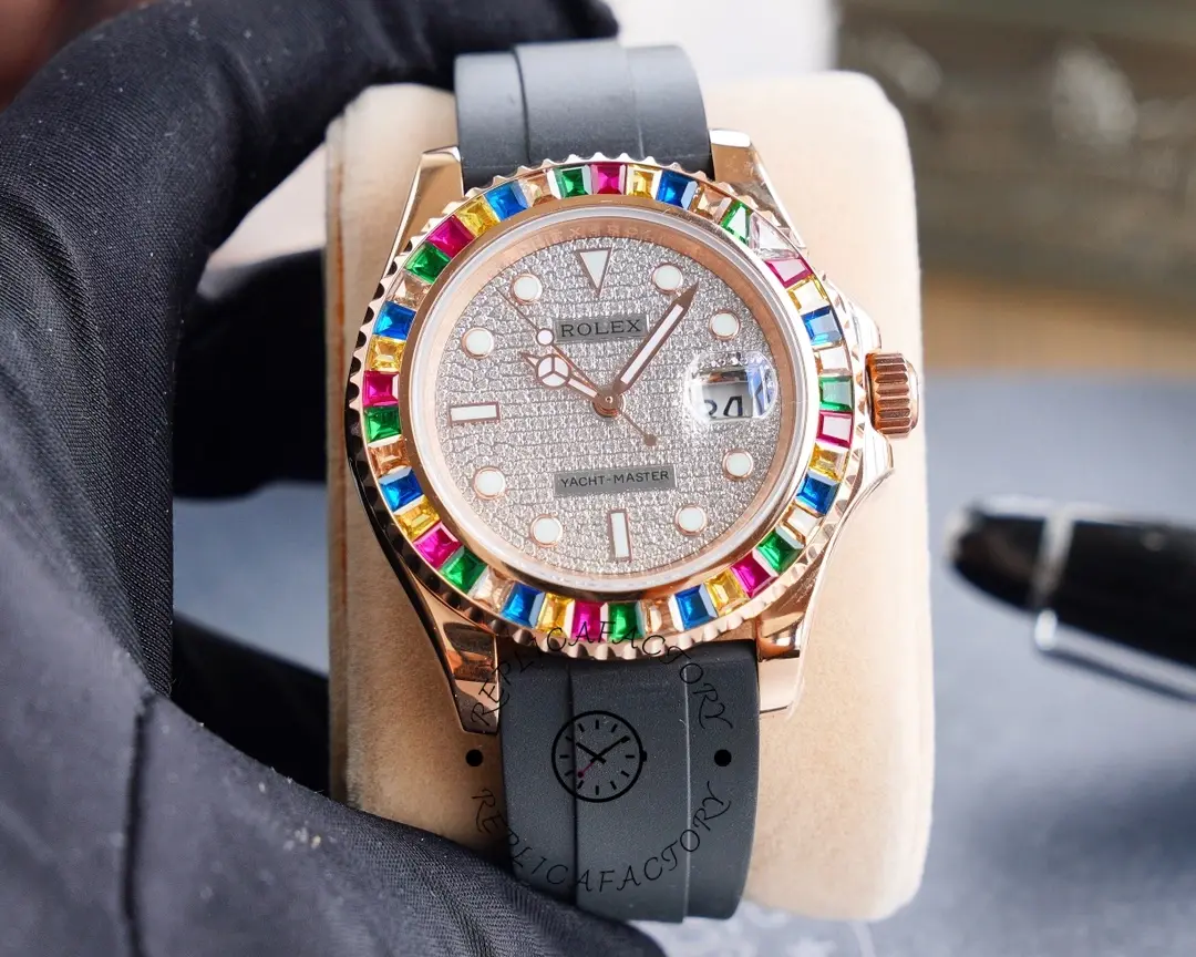 Glove-held front view of the Rolex Yacht-Master 116695SATS showing diamond dial and rainbow bezel.