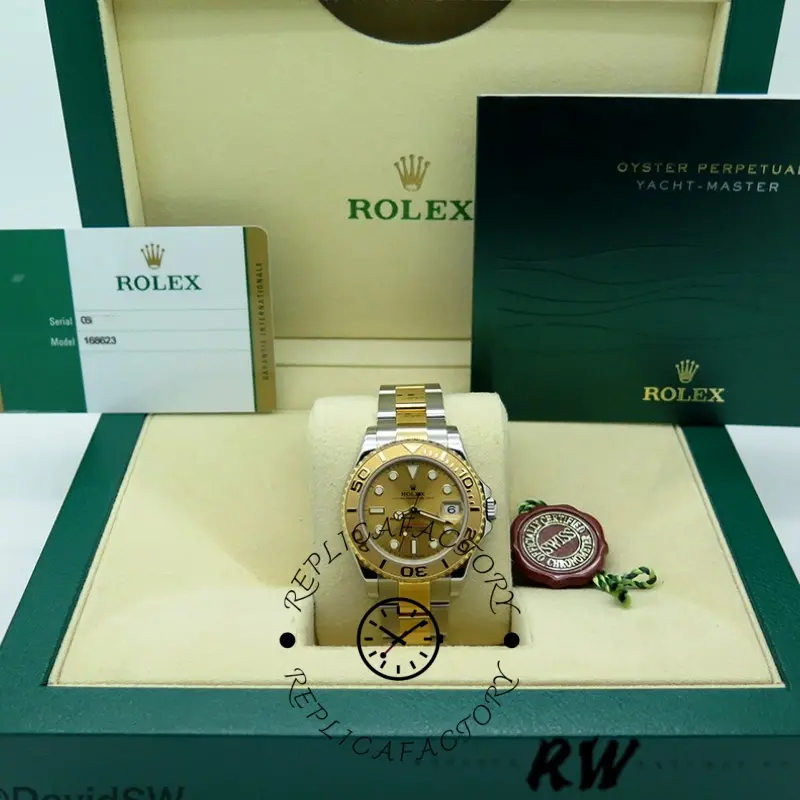 Rolex Yacht-Master 168623 full set display with box, tags, and champagne dial watch.