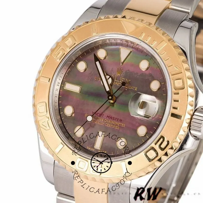 Close-up of Rolex Yacht-Master 16623 black MOP dial and gold bezel, showing hour markers.
