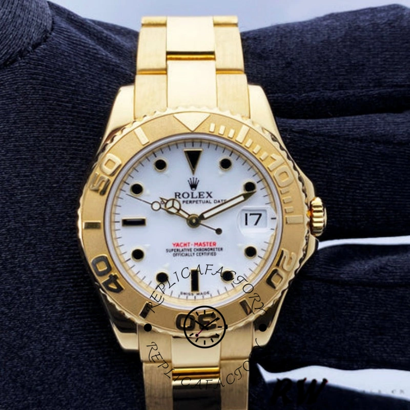 Rolex Yacht-Master 168628, gloved hand front view showing white dial and bezel numerals.