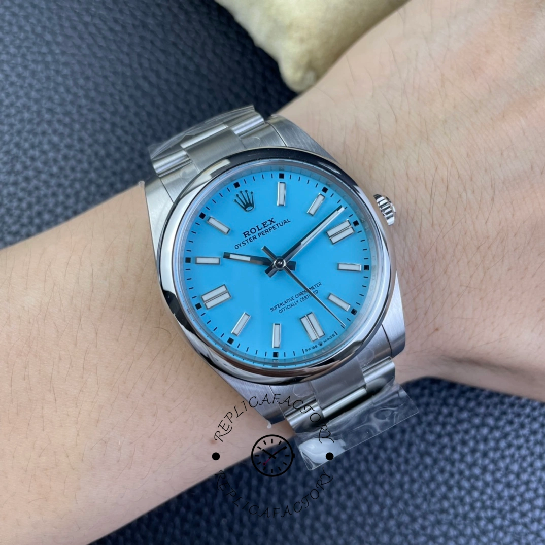 Rolex Oyster Perpetual 41 m124300 0006, wrist shot showing turquoise dial on steel bracelet.