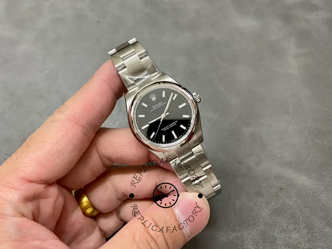 Rolex Oyster Perpetual 31 277200-0002 full watch view in hand, Oyster bracelet visible.