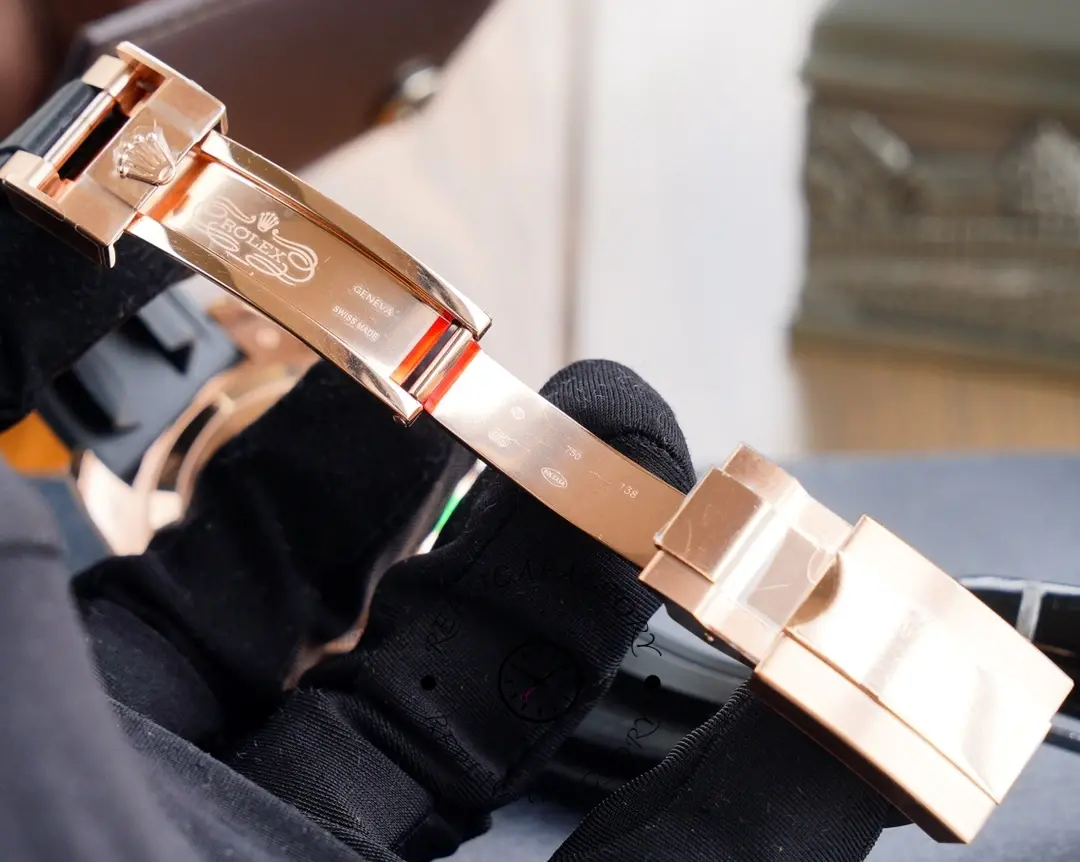 Clasp open view of the Rolex Yacht-Master 116695SATS showing strap underside and clasp structure.