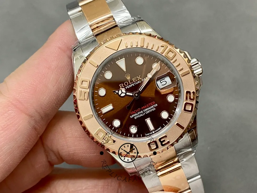 Rolex Yacht-Master 268621 held in hand, front view of chocolate dial and bezel.