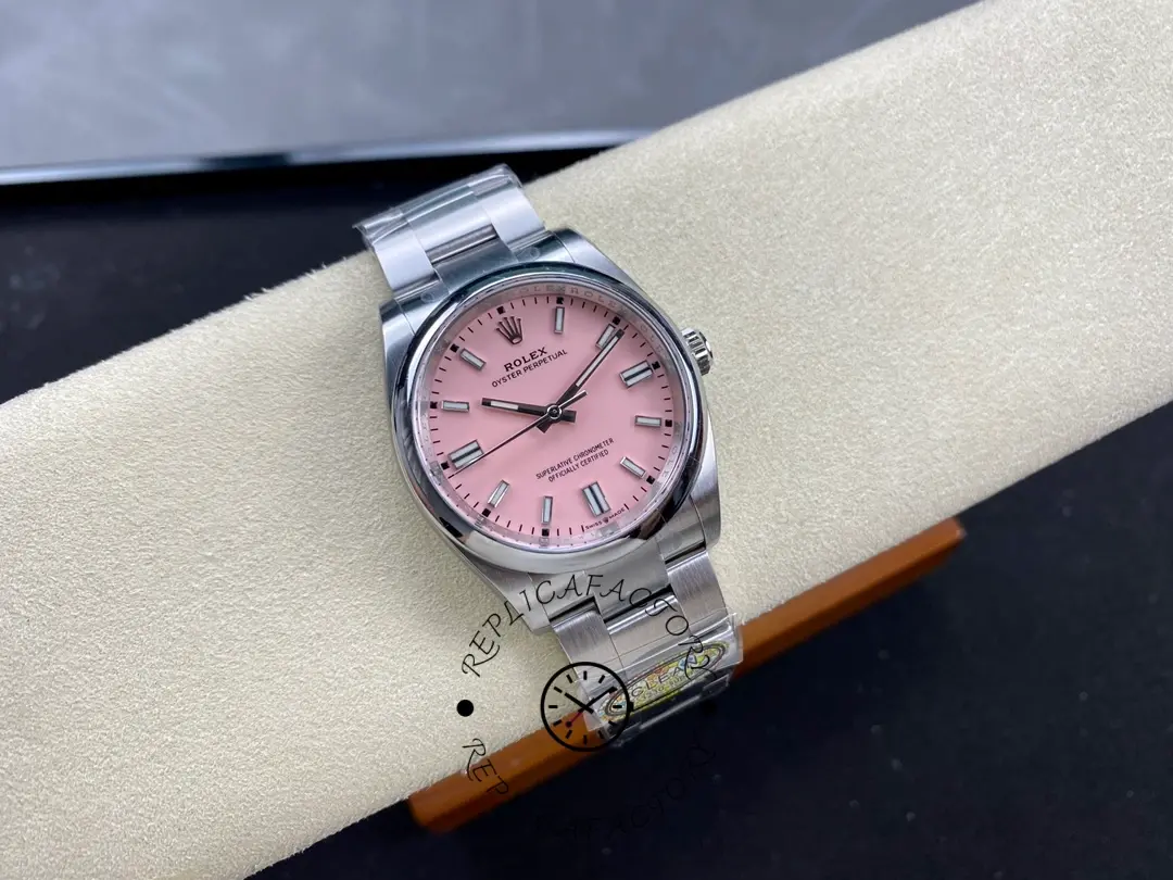 Rolex Oyster Perpetual 126000-0008, pink dial, wrist roll shot, front view.