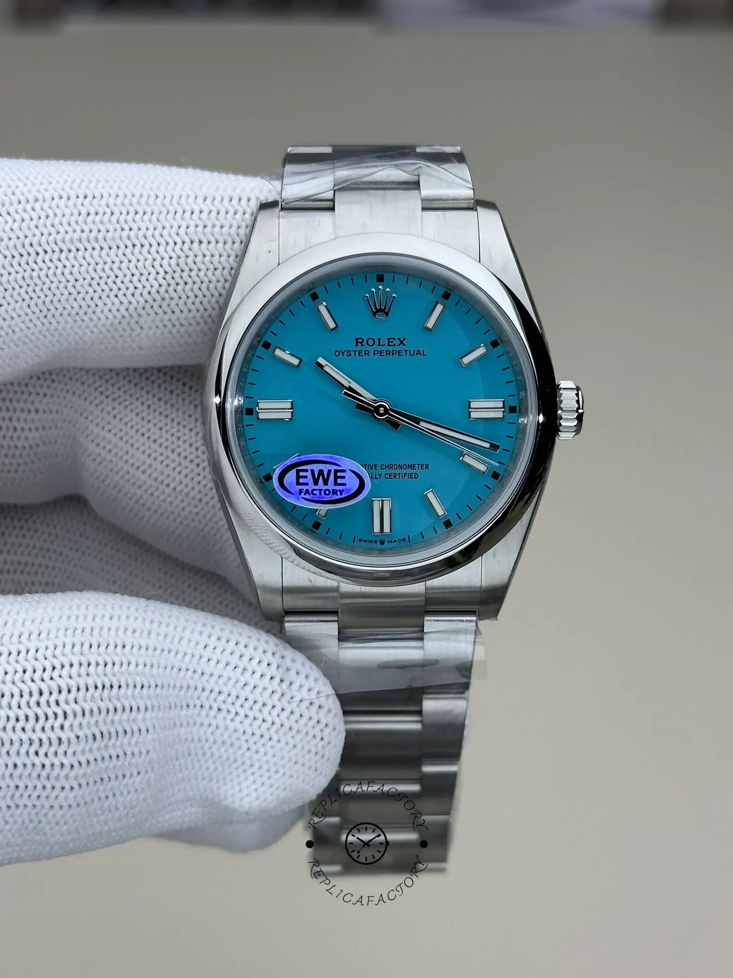 Rolex Oyster Perpetual 36 126000, gloved hand front view showing baby blue dial.