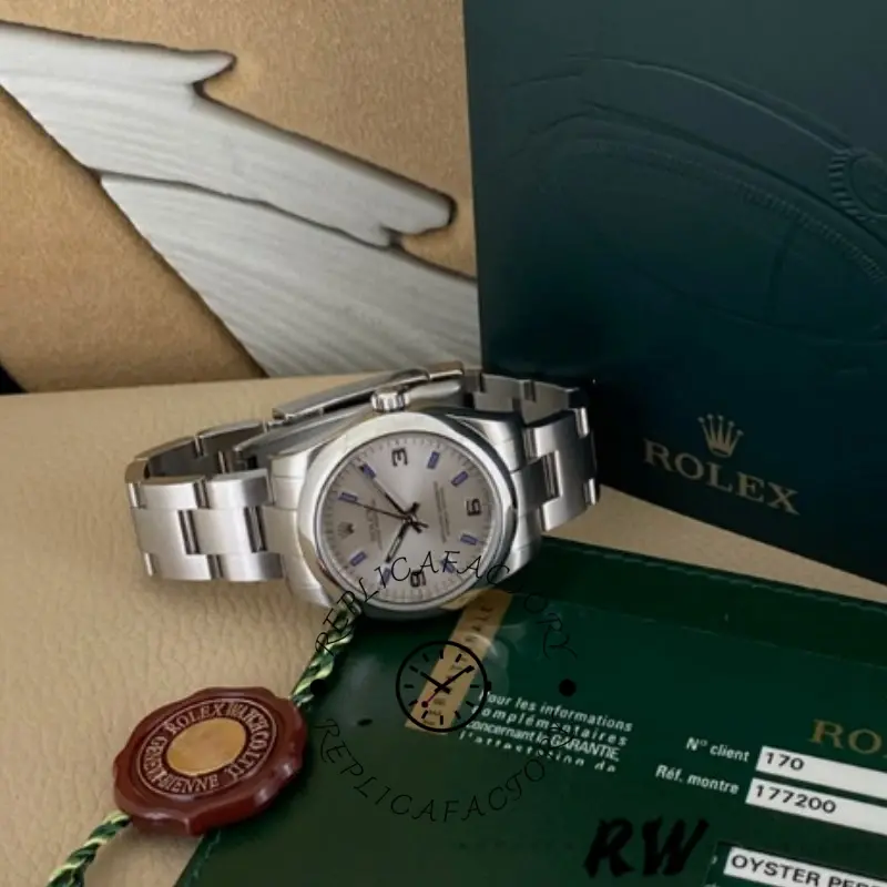 Rolex Oyster Perpetual 177200 box set view, silver dial watch with cards and green box.