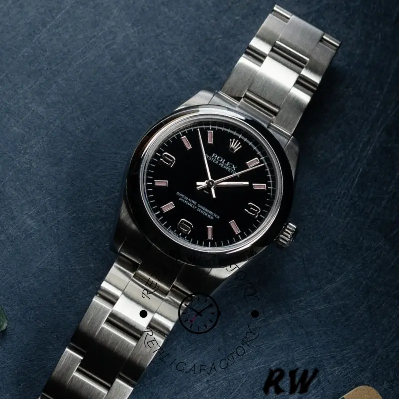 Rolex Oyster Perpetual 177200, angled wrist shot showing black dial and Oyster bracelet, 31mm.