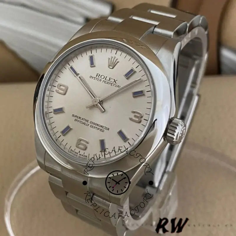 Rolex Oyster Perpetual 177200 close-up, silver dial with blue markers, bezel and hands detail.