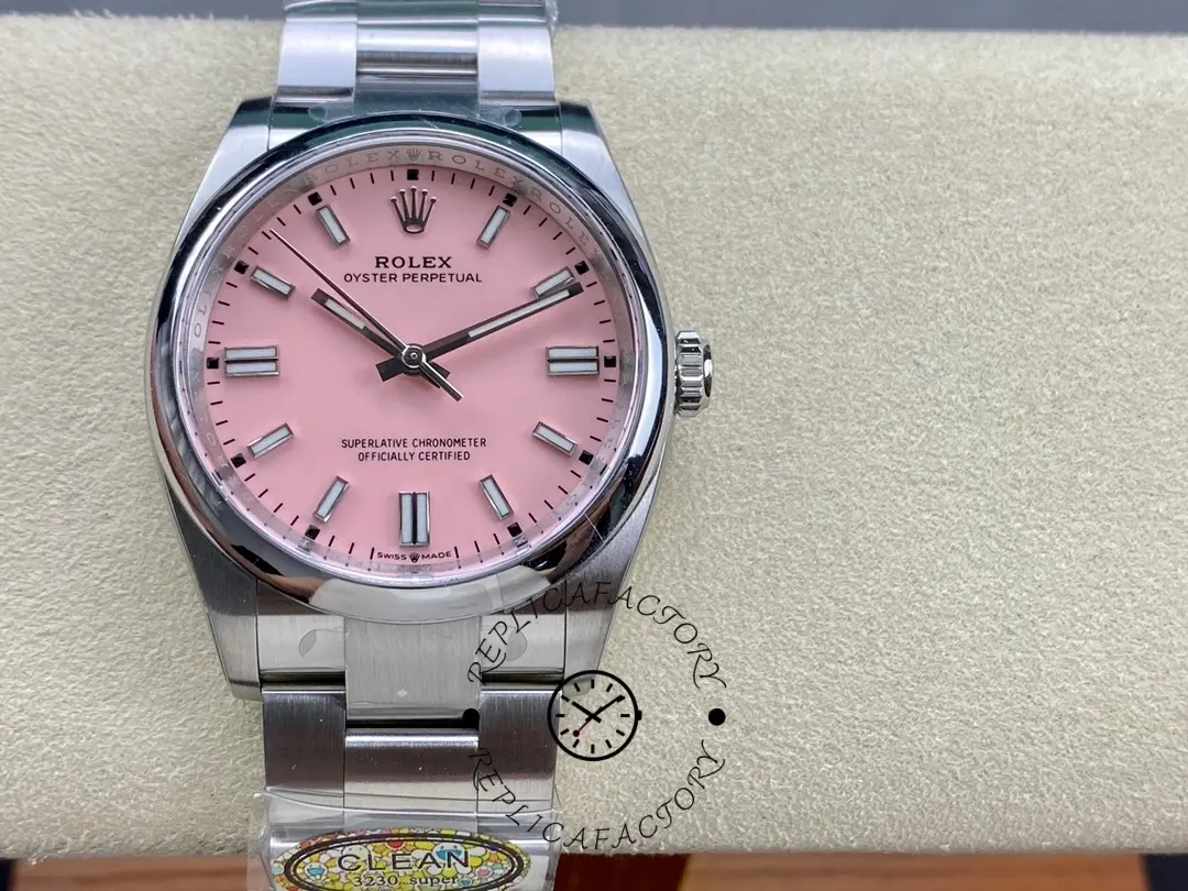 Rolex Oyster Perpetual 126000-0008, pink dial, watch on cushion display.