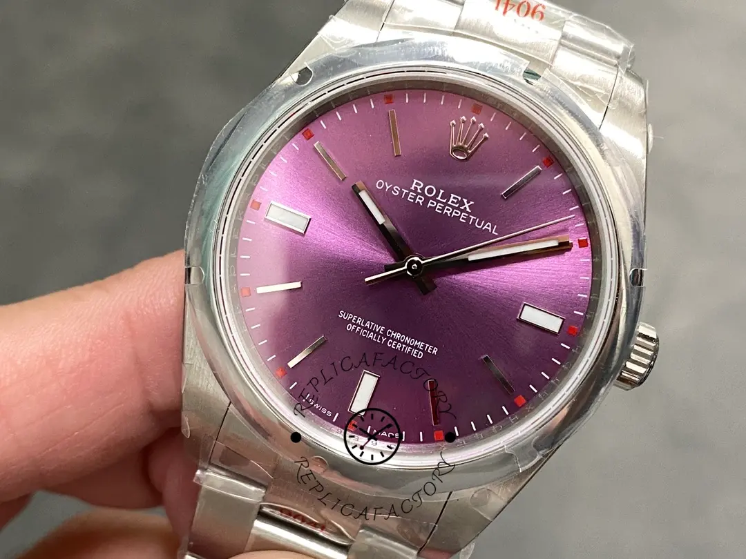 Close-up of the Rolex Oyster Perpetual 39 114300 0002 showing markers, hands, and dial text.