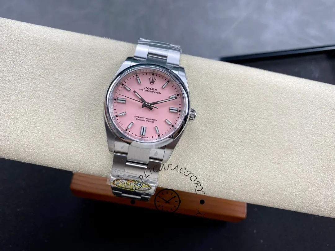 Rolex Oyster Perpetual 126000-0008, pink dial, wrist shot on bracelet.