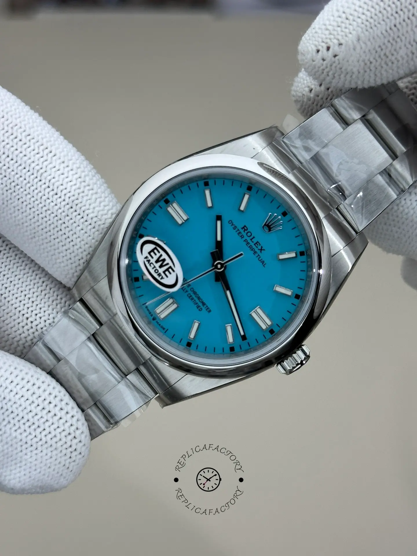 Rolex Oyster Perpetual 36 126000, gloved close-up showing case and bracelet links.