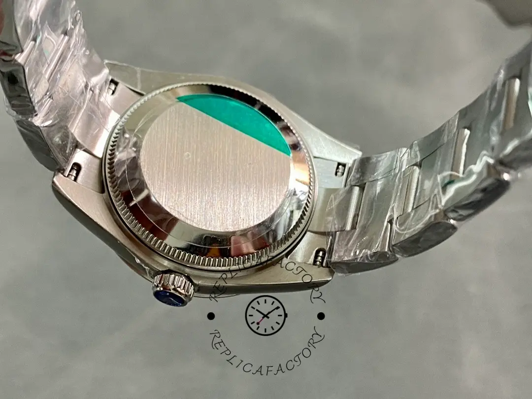 Rolex Oyster Perpetual 31 277200 0007, caseback view showing solid back with protective film.