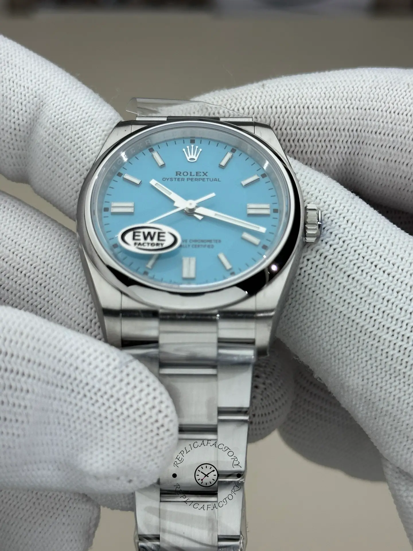 Rolex Oyster Perpetual 36 126000, gloved hand angled view showing bezel and lugs.
