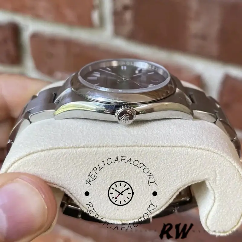 Rolex Oyster Perpetual 116000 low side view, case thickness and lugs detail, on cushion.