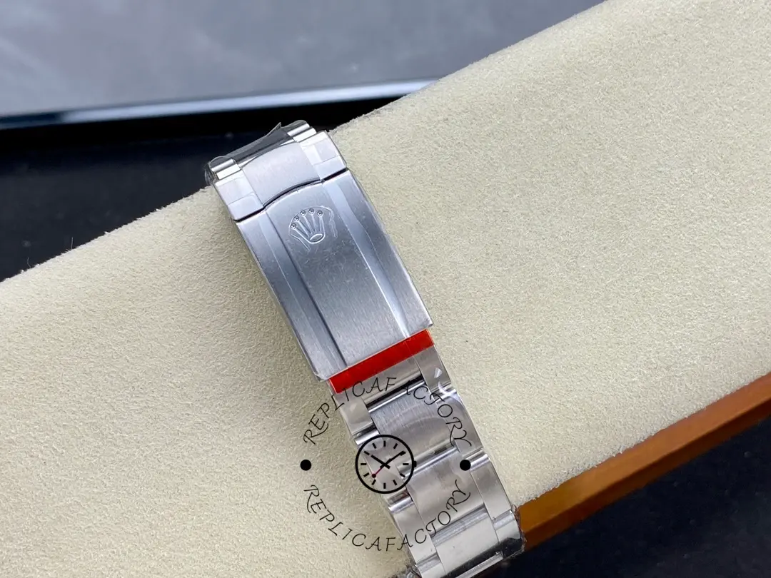 Rolex Oyster Perpetual 126000-0008, bracelet and clasp view on display roll.