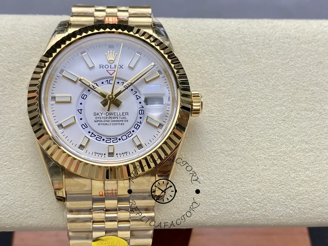 Rolex Sky-Dweller M336938 0006, front on cushion, showing white dial and gold bracelet.