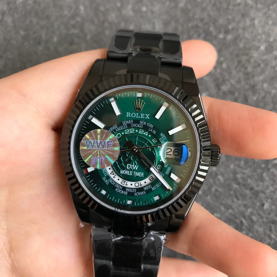 Rolex DiW Sky-Dweller 326934, hand-held close-up of green dial and bezel.