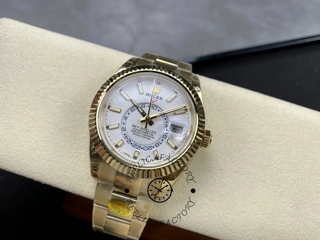Full watch view of the Rolex Sky-Dweller M336938 0003 on pillow showing gold bracelet and dial.