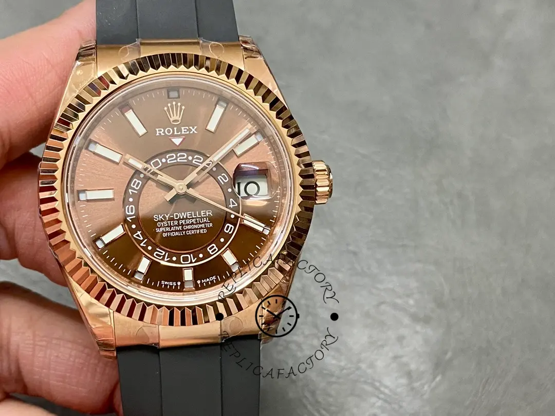 Handheld front view of Rolex Sky-Dweller m336235 0002, showing dial layout and fluted bezel.