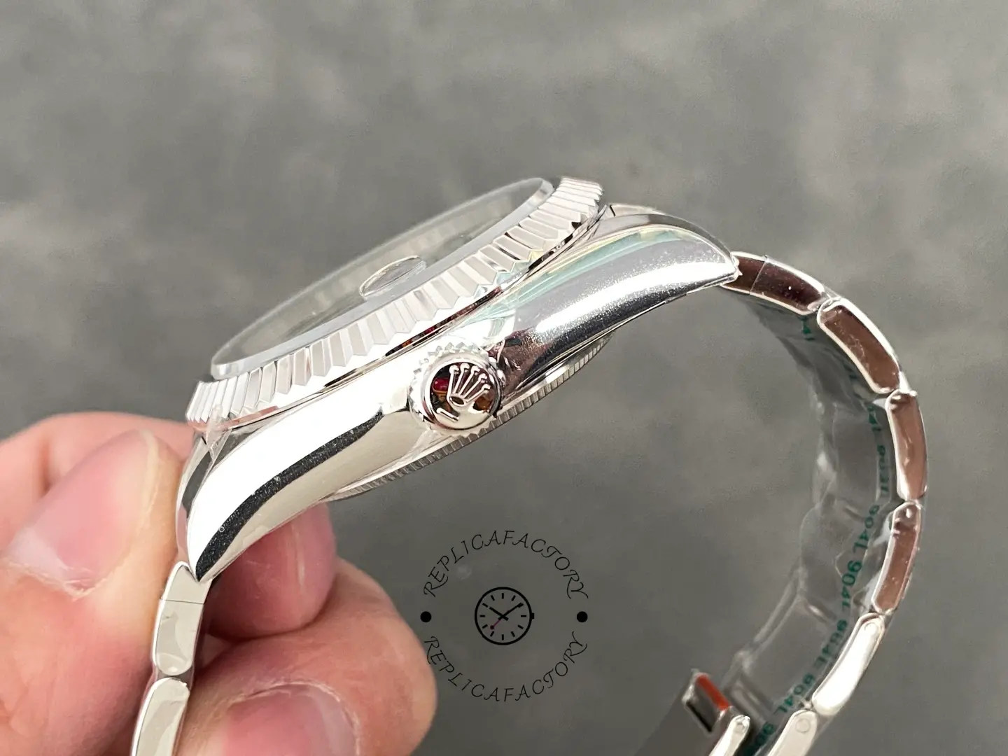 Side view of the Rolex Sky-Dweller 336934 showing the fluted bezel and stainless steel case profile.
