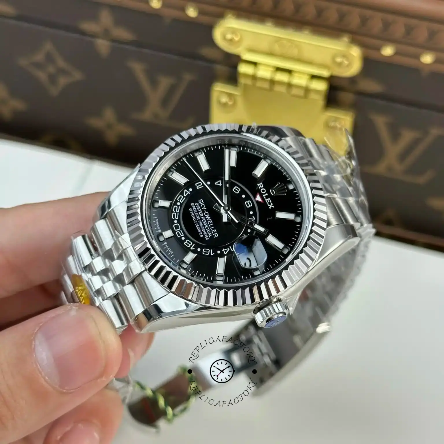 Close-up of Rolex Sky-Dweller m336934 0008 dial, black dial markers and fluted bezel edge.