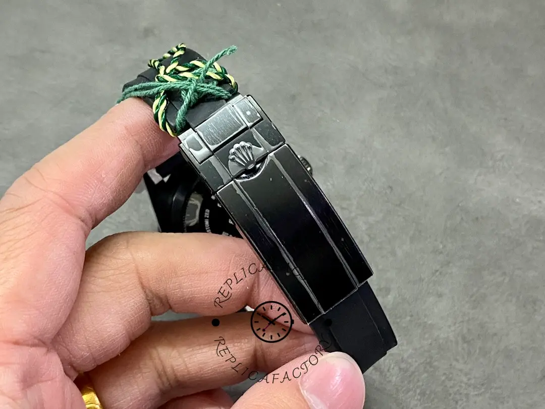 Rolex Blaken Submariner 116610, clasp/buckle detail on black strap.