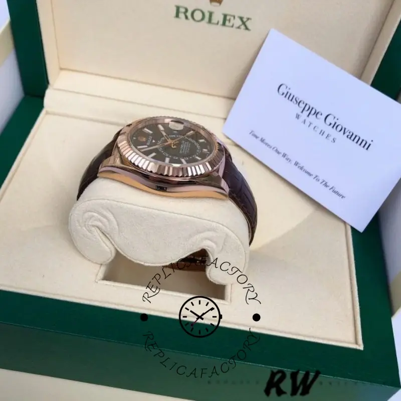 Rolex Sky-Dweller 326135 in box, top view showing dark rhodium dial and brown strap.