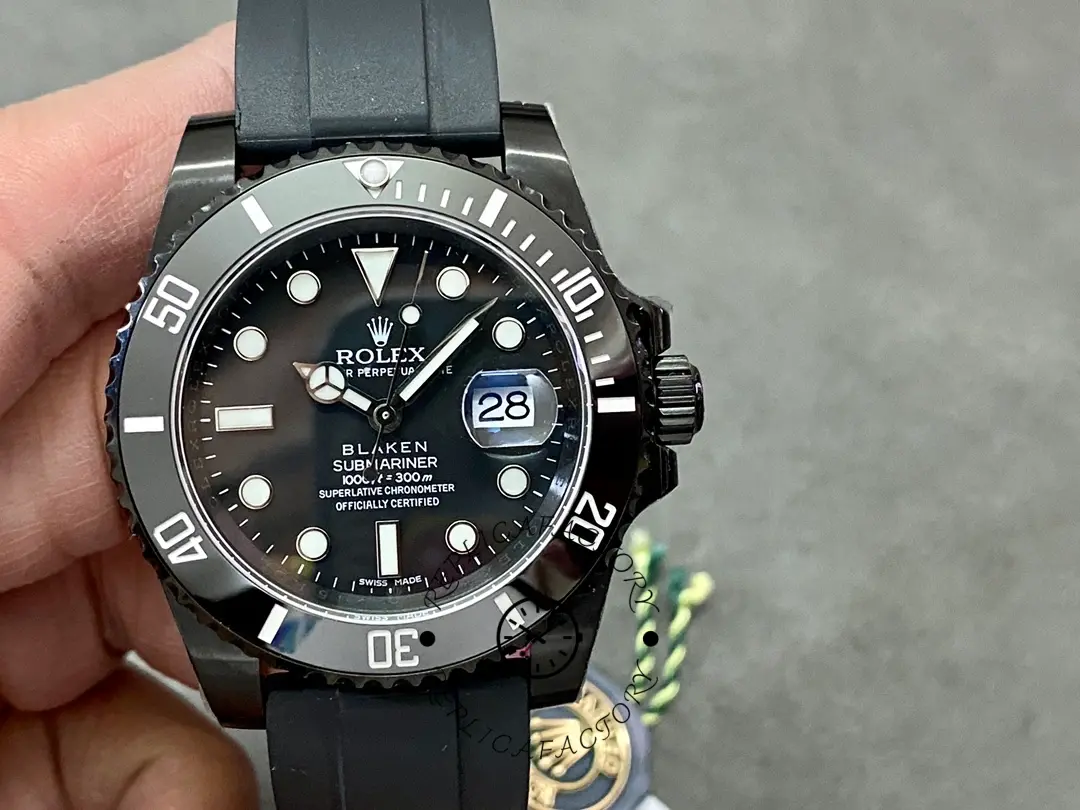 Rolex Blaken Submariner 116610, close-up of black dial and bezel.