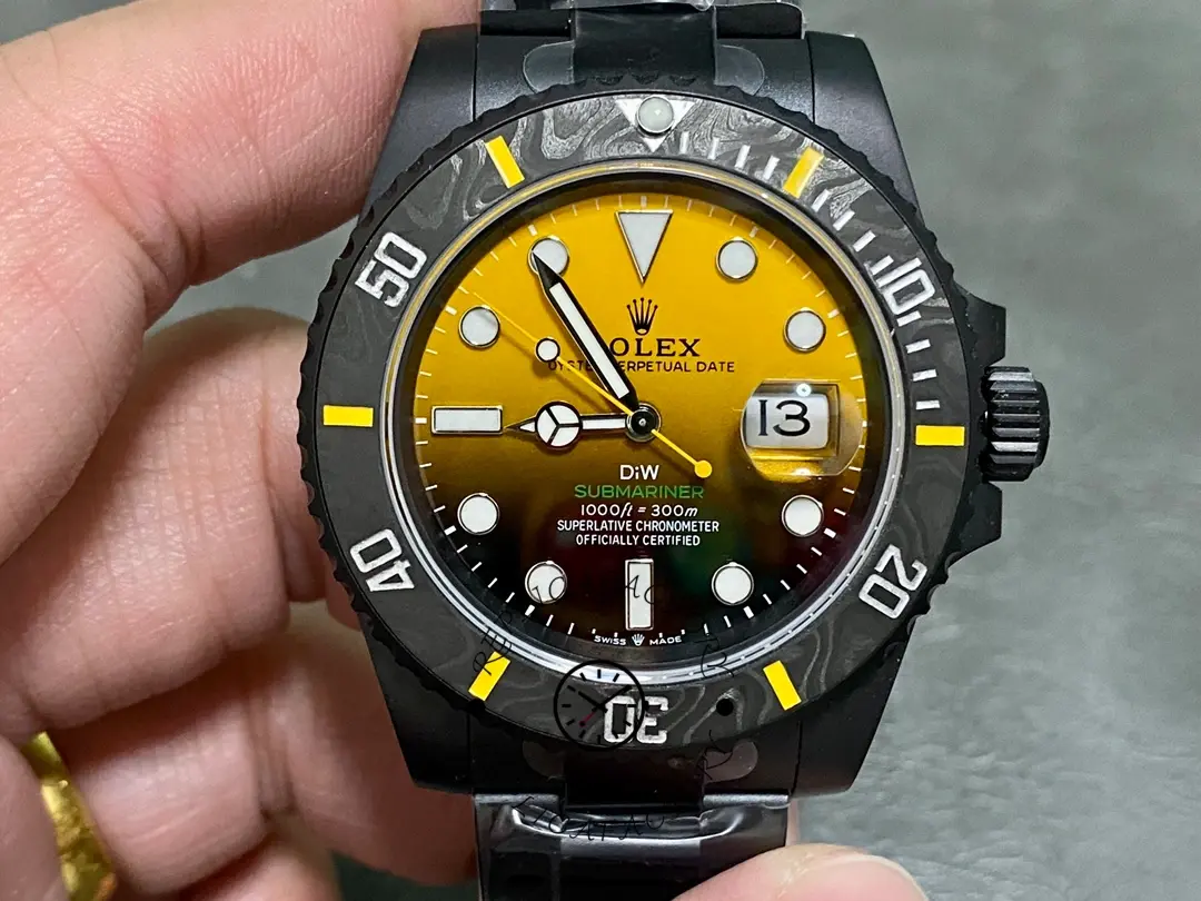 Rolex Submariner 116610, yellow dial close-up on wrist/hand.